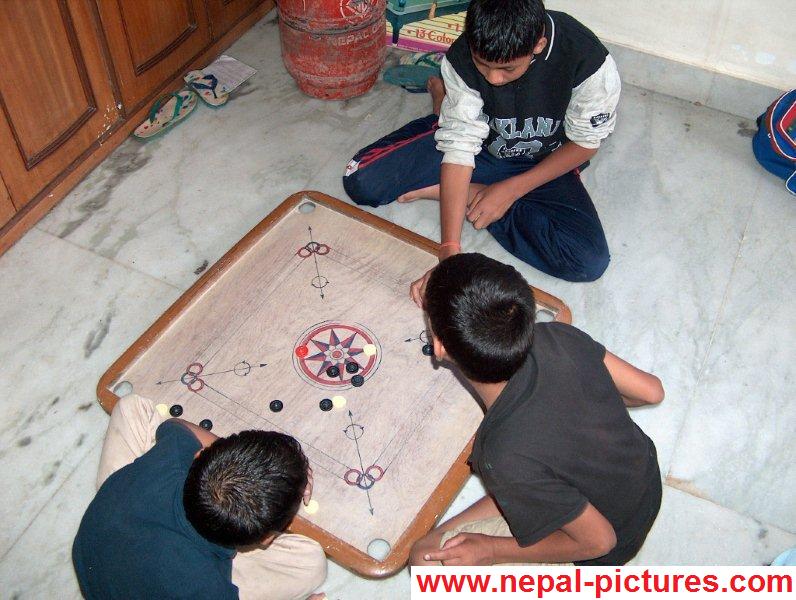 Children playing carromboard
