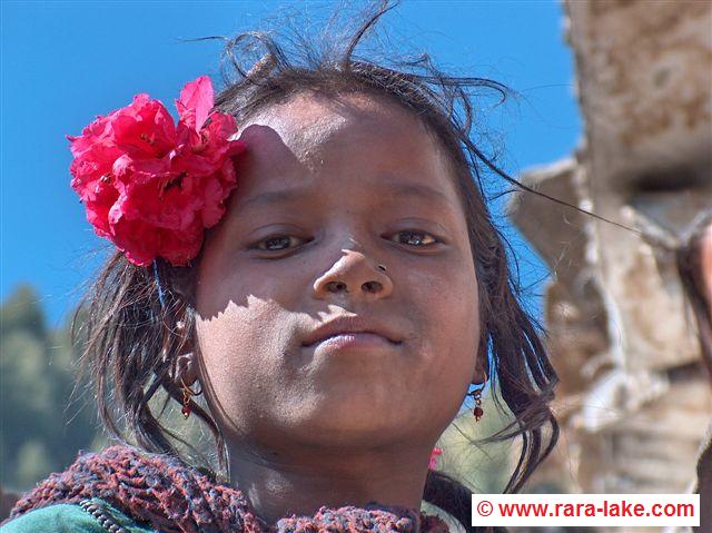 Girl with Rodondendren flower in Murma village